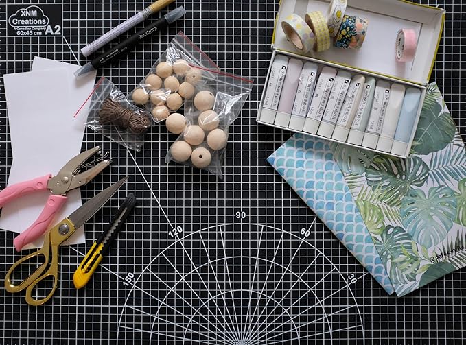 XNM Premium Self Healing Cutting Mat - 18 Inches by 24 inches - A2, 3 Layer Quality PVC Construction - Dual Sided, Imperial and Metric Grid Lines - Perfect for Cutting, Sewing, and Crafts